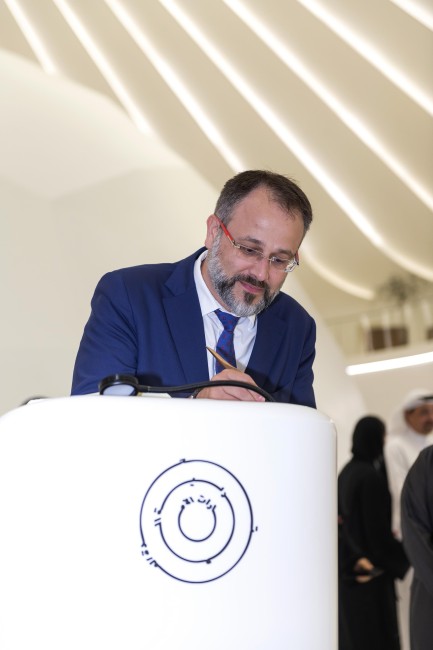 ]His Excellency Victor Haruta_ Ambassador of the Republic of Moldova to the UAE and Commissioner General of Moldova Pavilion at Expo 2020 Dubai signs the Book of Honour at the UAE Pavilion during Moldova National Day<br />©Anthony Fleyhan/Expo 2020 Dubai